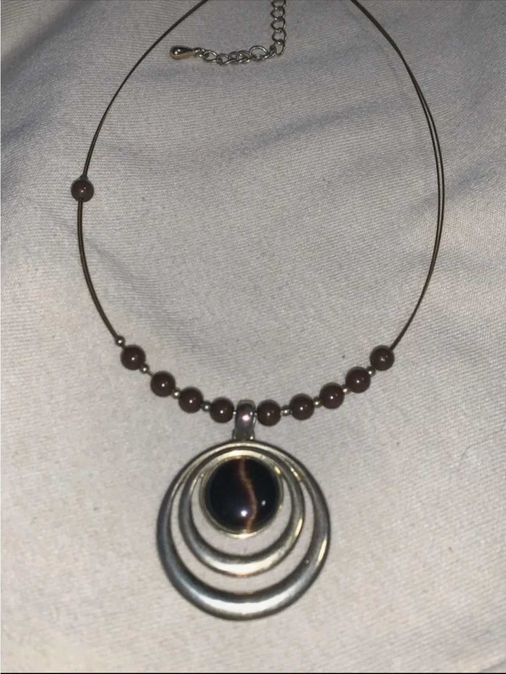 Elegant Brown Bead Necklace with Concentric Pendant